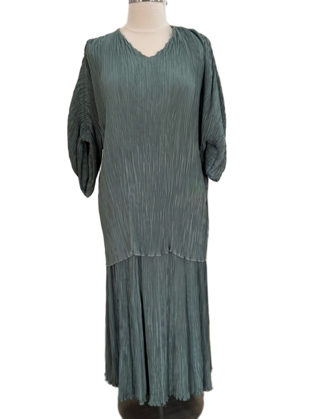 Pleated, signed, & hand colored sage green top and skirt